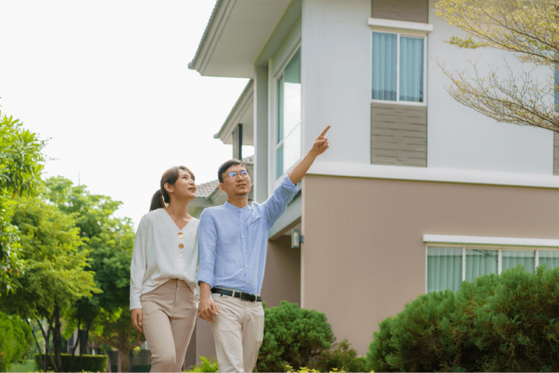 couple looking at house and lots